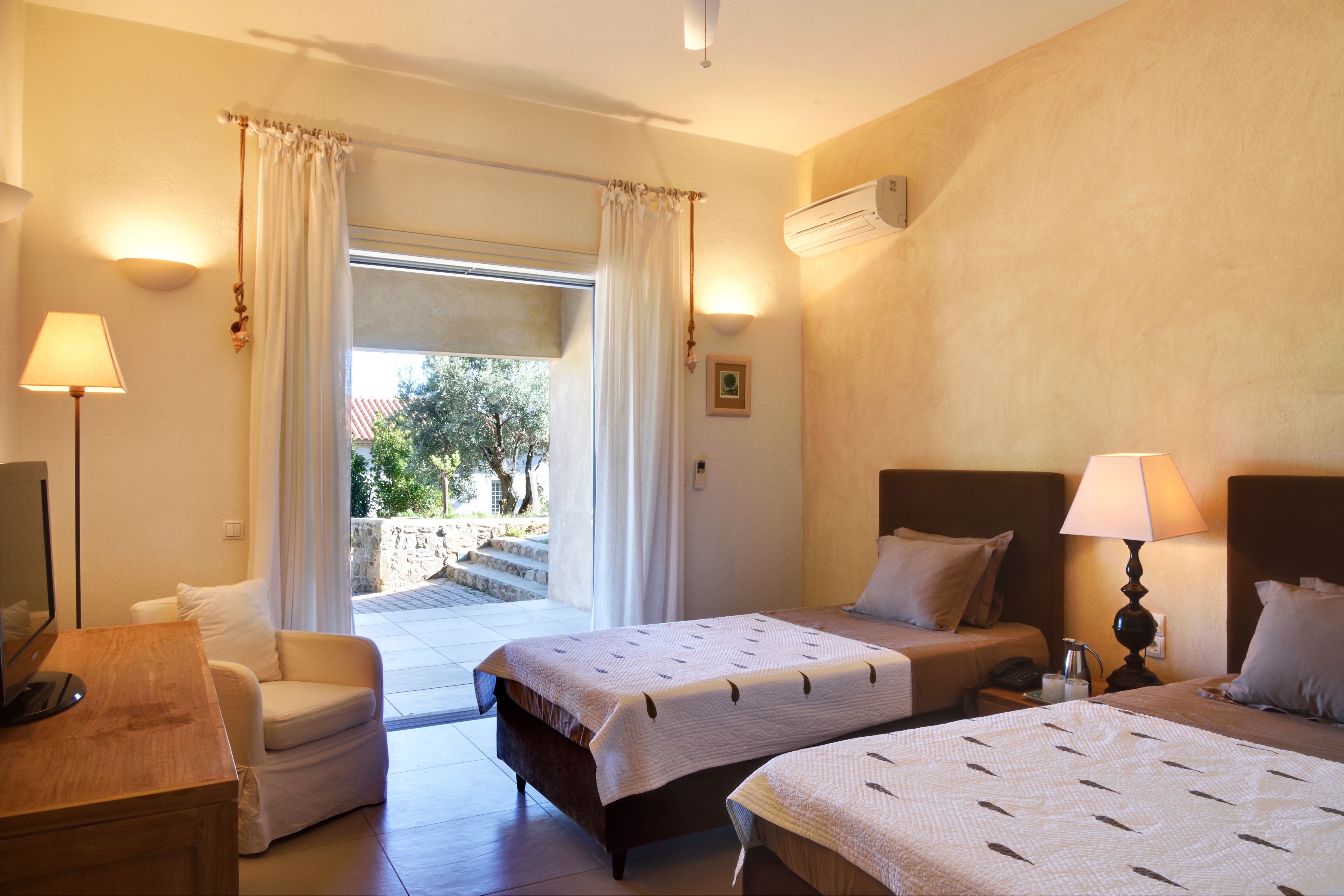 A ground-floor twin suite with its own doors to the terrace