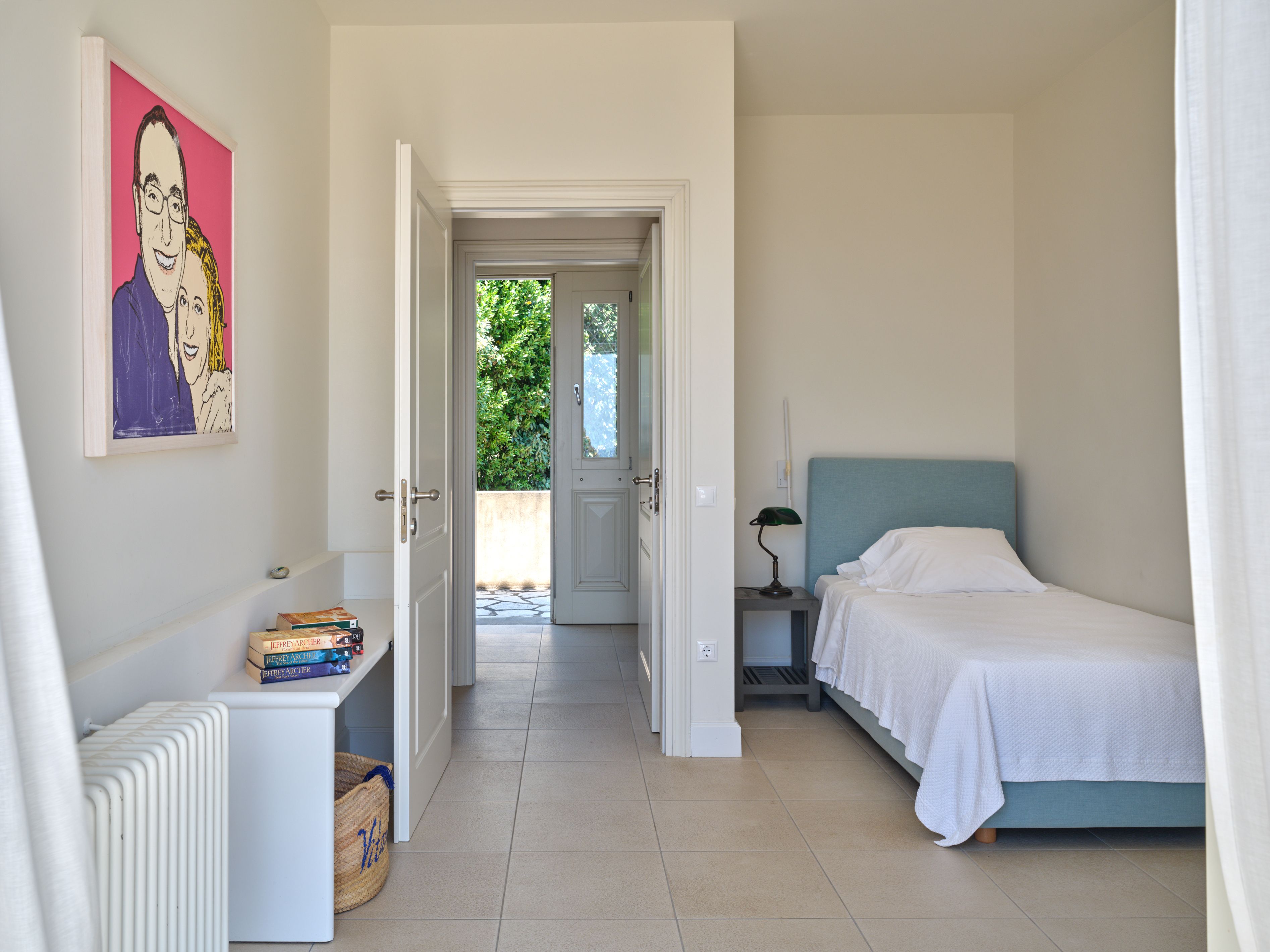 The single-bed bedroom beside the master
