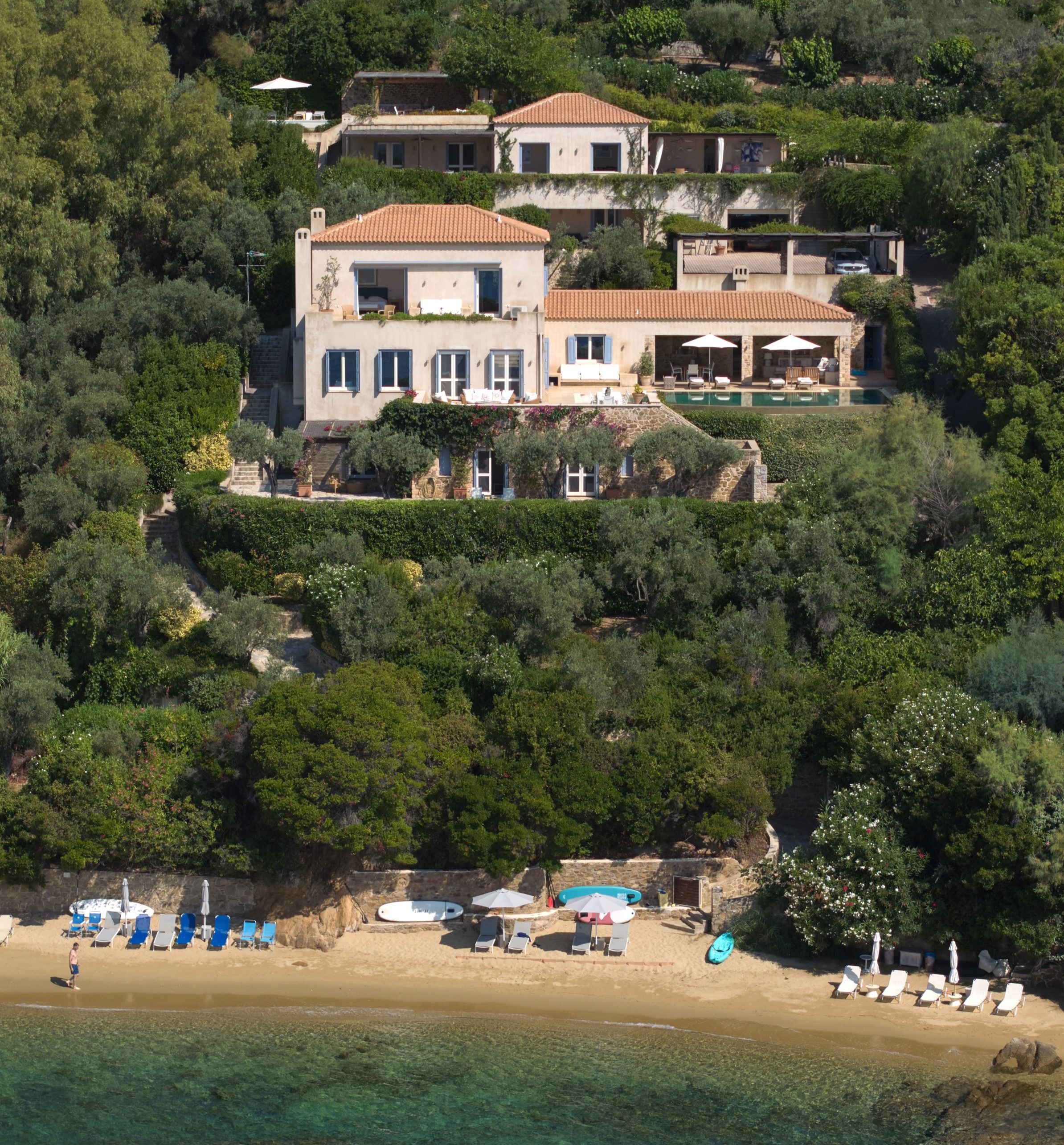 Both villas on the hillside above the estate's golden sand beach