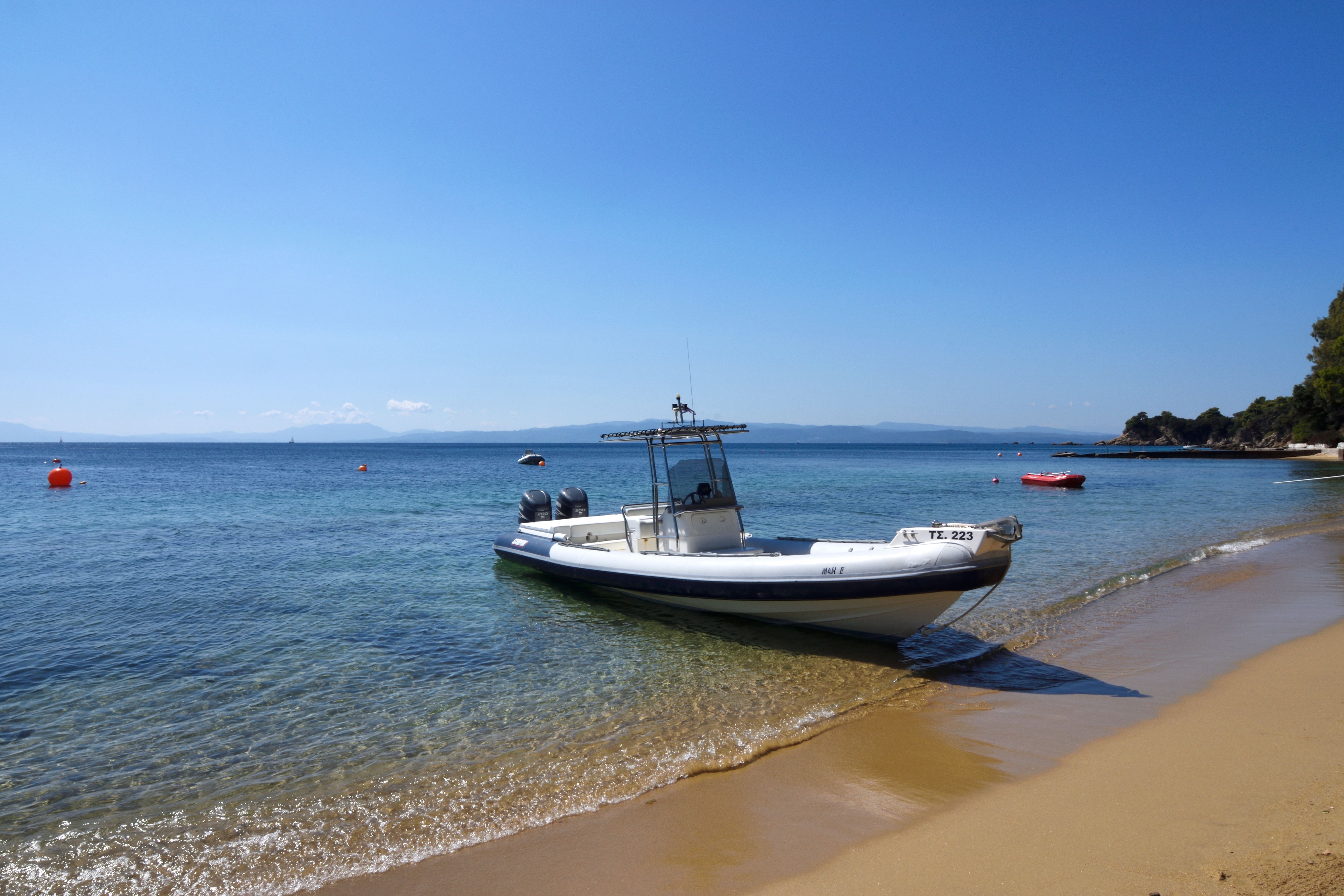 A RIB run in bow-first onto the sand of the beach